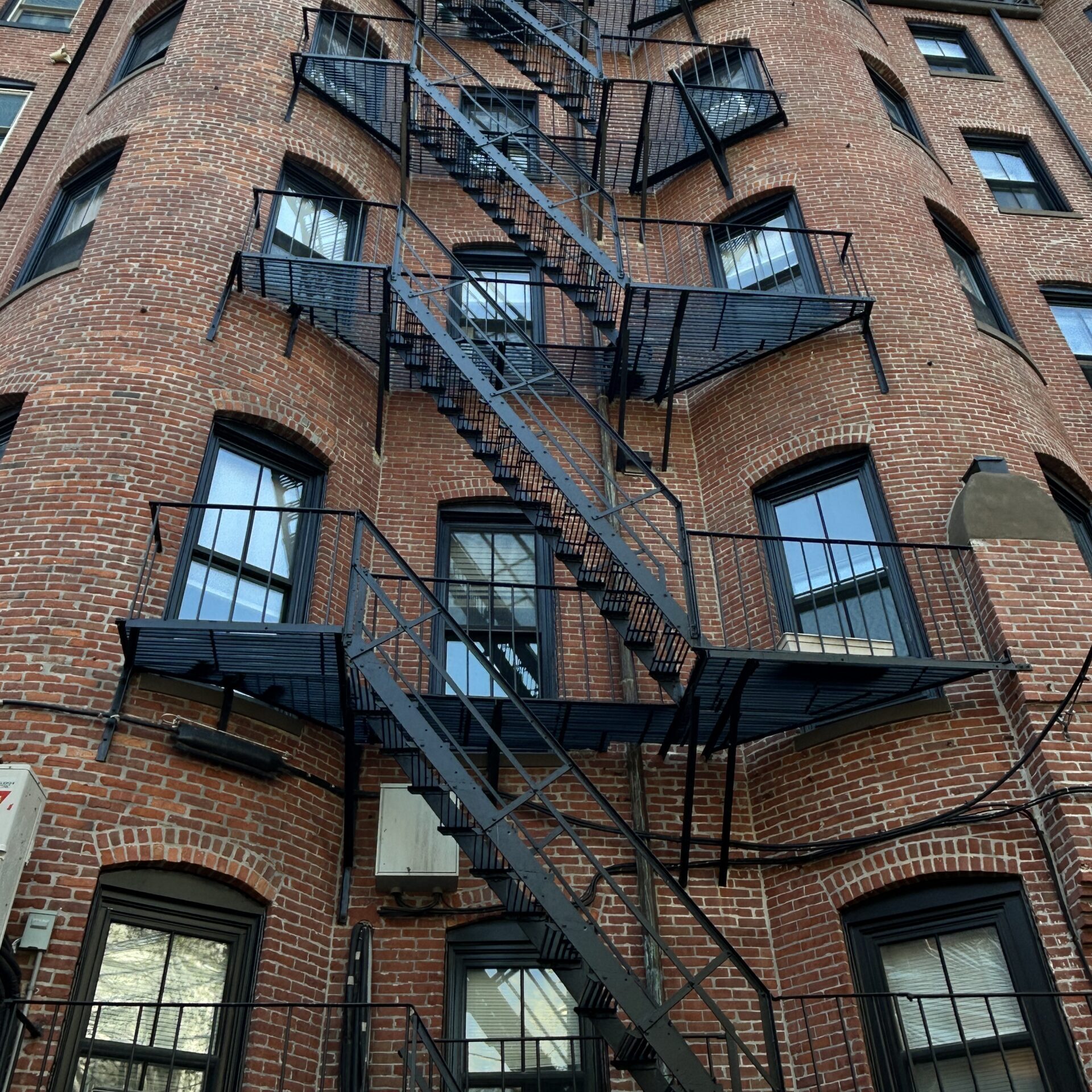 Brick building with zigzagging metal fire escape